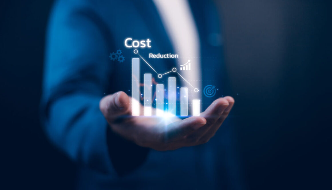 Businessman analyzing quality control and cost reduction graph on laptop, illustrating strategies on how to reduce operational costs at sports facilities.