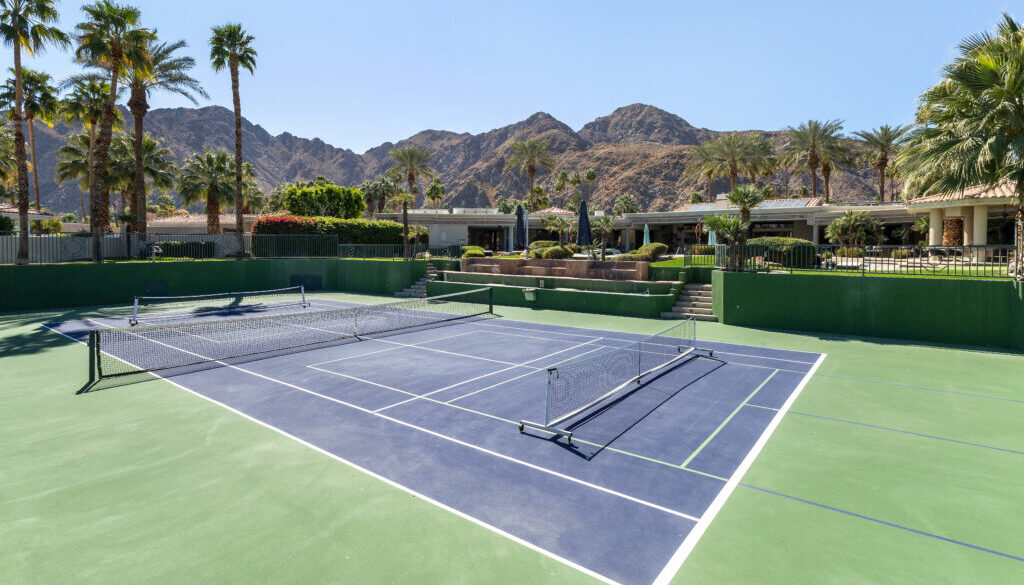 Outdoor pickleball court at a multi-use facility, showcasing effective pickleball court management in a scenic setting