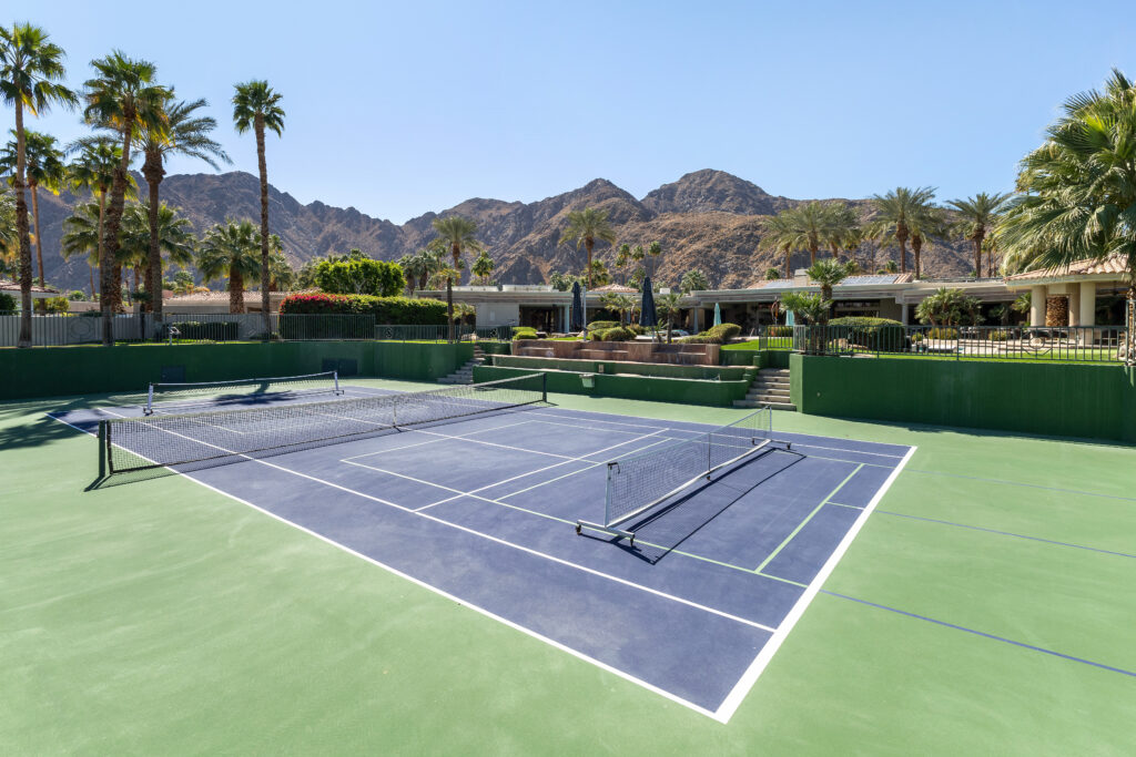 Outdoor pickleball court at a multi-use facility, showcasing effective pickleball court management in a scenic setting
