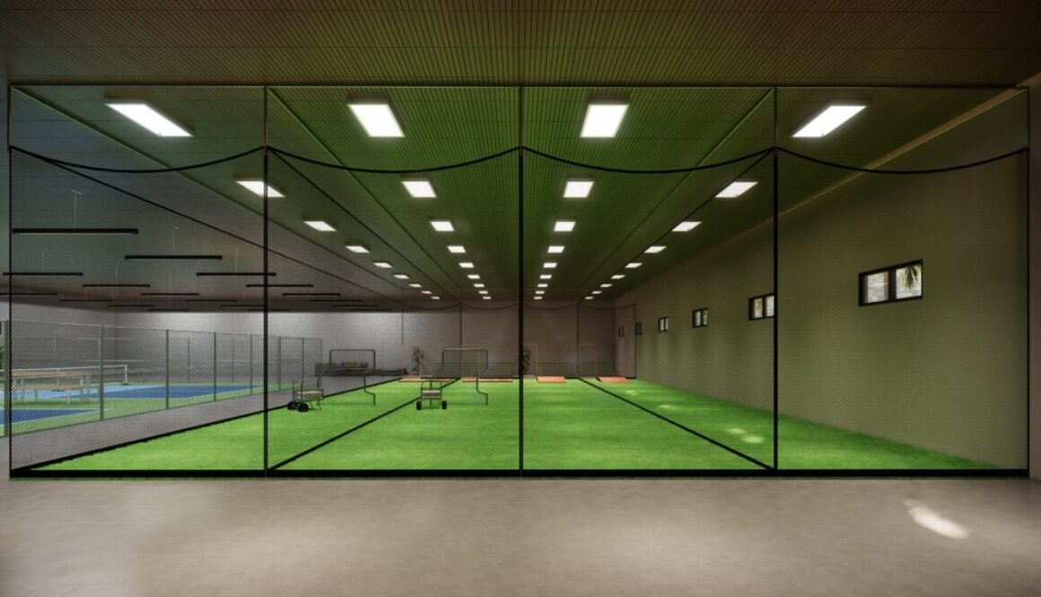 Modern multi-sport indoor facility with turf fields and hard courts for baseball, softball, and tennis training.