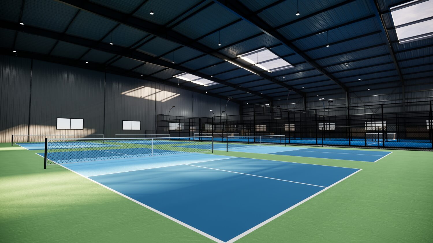 An indoor tennis facility with multiple courts, highlighting a well-planned club layout and design, an essential component of a comprehensive tennis club business plan